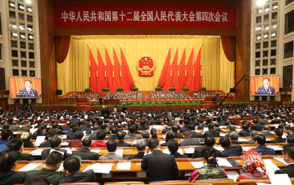 China's top procurator delivers work report