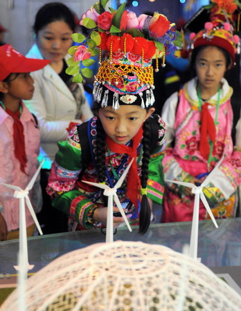 Children walk out of mountain for Expo