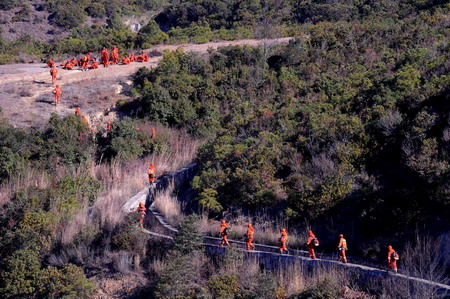Fire raging in SW China forest for three days