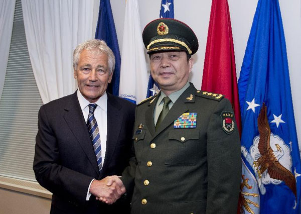 China's Defense Minister Chang Wanquan shakes hands with US Secretary of Defense Chuck Hagel during their meeting in the Pentagon, on Aug 19, 2013. China, US to enhance military cooperation