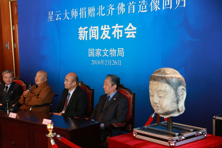 Stolen Buddha head statue returns to Chinese mainland after 20 years