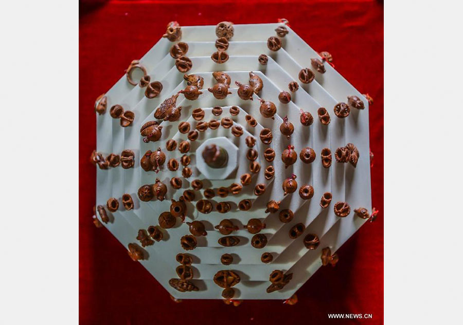 Peach pit carving: Chinese folk art on fingertips