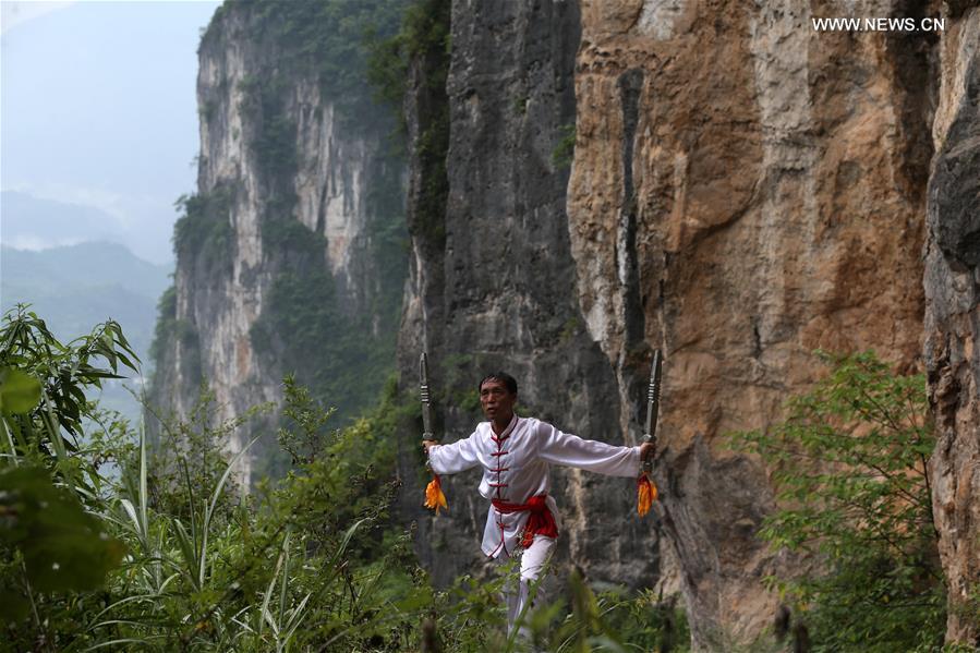 Children learn about Chinese Wushu during summer vacation in SW China