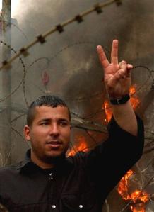 An anti-U.S. 
 Lebanese 
 protestor gestures with his hand during a demonstration near the U.S. Embassy in Aukar northeast of Beirut, Lebanon, Tuesday March 22, 2005. [AP]