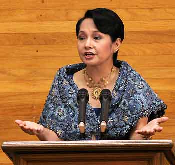 Philippine President Gloria Macapagal Arroyo gestures while making her State of the Nation Address (SONA) at a joint session of congress in the House of Representatives in Manila July 25, 2005. 