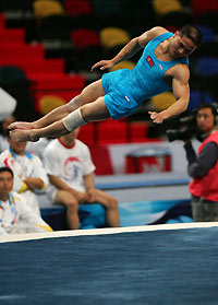 orth Korea's gymnast Ri Jongsong performs during the men's floor exercise final at the 4th East Asian Games in Macau November 2, 2005. North Korea's Ri won the gold while South Korea's Kim Seung Il shared the silver with Japan's Naoya Tabara.