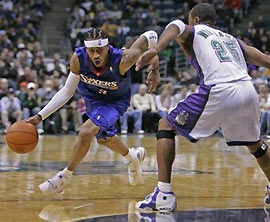 Portland Trail Blazers' Darius Miles (23) is fouled by Miami Heat's Alonzo Mourning (33) on a first-half shot Wednesday, Nov. 23, 2005, in Miami. 