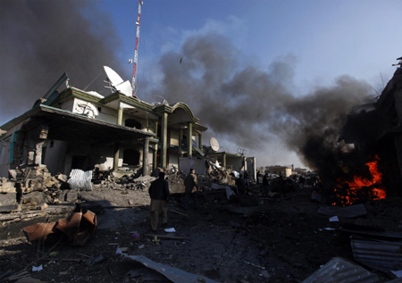 Afghan official: 8 killed in suicide bombing