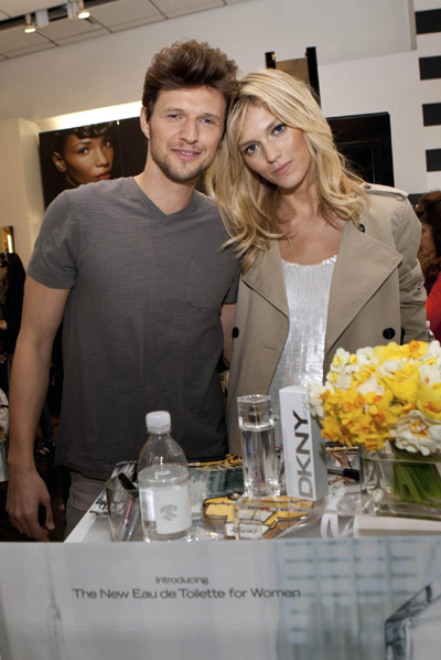 Rubik signs a poster in Sephora store in Time Square