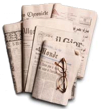 Why does a newspaper tear smoothly up and down but not side to side?