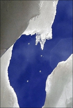 Close up of a melting glacier. Fresh water, the stuff of life, is set to become even more precious as global warming begins to bite, experts warned. The theme of this year's World Water Day is water scarcity, a problem familiarly driven by population explosion, chronic wastage and pollution.