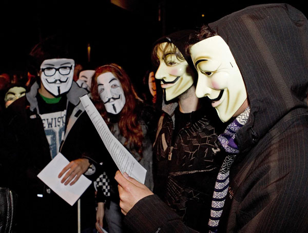 'Anonymous' protesters rally for Assange