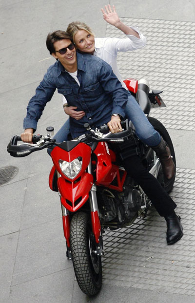 Cruise and Diaz ride motorbike during the filming of