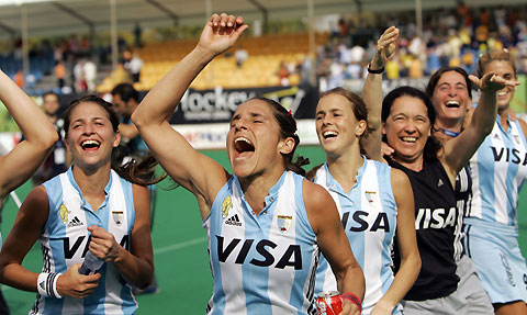 Argentina's players celebrate after their women's World Cup field hockey match against Spain in Madrid October 8, 2006. Argentina claimed the bronze medal in the women's World Cup in Madrid when they trounced hosts Spain 5-0 in the third-fourth place playoff on Sunday.