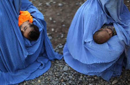 Displaced people at a repatriation centre in Pakistan