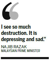 Floods kill 21 in Malaysia, waters recede