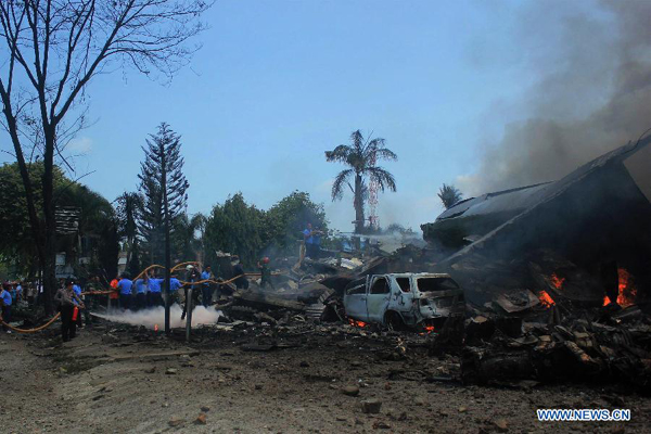 Military plane crashes into residential area in Indonesia